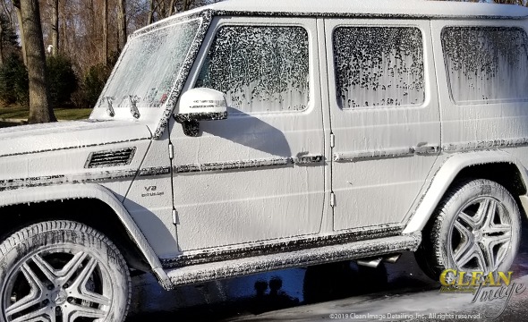 White Mercedes Truck in foam bath.