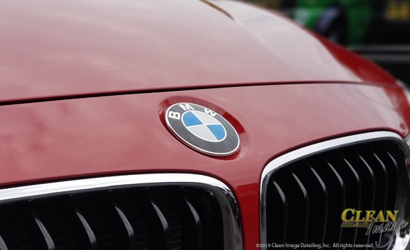 BMW logo on red 3 series.