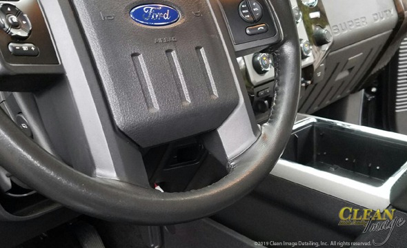 Ford steering wheel with yellow paint removed.