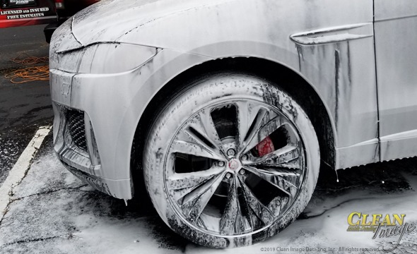Mobile Detailing: Gunmetal gray Jaguar in foam bath.