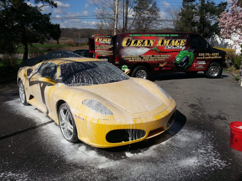 Clean Image Detailing yellow Ferrari foamed for cleaning.